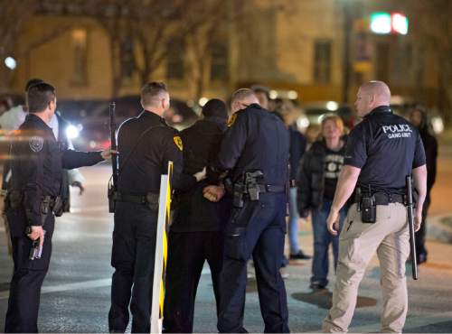 Lennie Mahler  |  The Salt Lake Tribune

Police arrest a man after a crowd formed protesting the officer-involved shooting of 17-year-old Abdi Mohamed at 200 South Rio Grande Street in Salt Lake City, Saturday, Feb. 27, 2016.