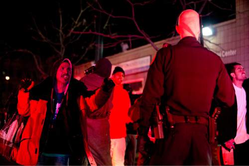 Lennie Mahler  |  The Salt Lake Tribune

A man shouts at a police officer following an officer-involved shooting at 200 South Rio Grande Street in Salt Lake City, Saturday, Feb. 27, 2016.