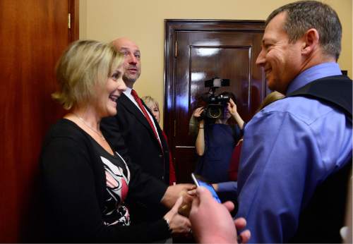 Scott Sommerdorf   |  The Salt Lake Tribune  
Linae Tiede Coates and Nathan Coates, left, speak with Rep. Paul Ray, R-Clearfield, about his efforts to prevent SB189 from passing, Thursday, March 10, 2016. SB189 would abolish the death penalty in Utah. Linae Tiede Coates' mother and grandmother were murdered by Von Lester Taylor in 1991.