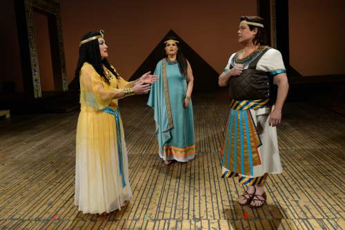 Francisco Kjolseth | The Salt Lake Tribune
Members of Utah Opera's production of "Aida" gather on set in costumes, wigs and makeup. They are Katharine Goeldner (Amneris, the Egyptian princess), left, Jennifer Check (Aida, the captive Ethiopian princess),  and Marc Heller (Radamès, the Egyptian soldier both women are interested in).