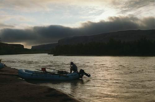 |  Tribune File Photo

Boater takes a morning smoke before setting off on the San Juan River at Sand Island BLM boat ramp 1 mile west of  Bluff Utah.