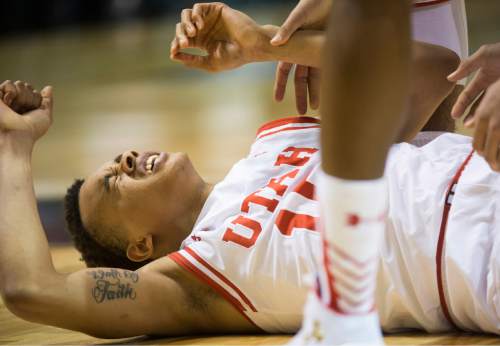 Rick Egan  |  The Salt Lake Tribune

Utah Utes guard Lorenzo Bonam (15) grimaces after falling to the floor, as Utah defeated USC Trojans 80-72, at the MGM Arena, in Las Vegas, Thursday, March 10, 2016.