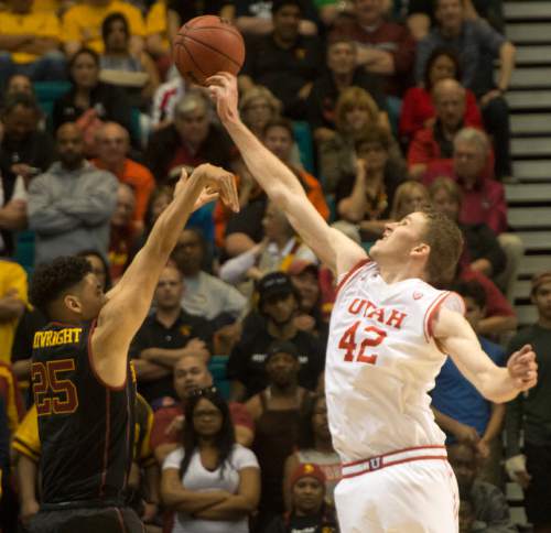 Rick Egan  |  The Salt Lake Tribune

Utah Utes forward Jakob Poeltl (42) blocks a 3-point attempt by USC Trojans forward Bennie Boatwright (25) in the final minute of the game, as Utah defeated USC Trojans 80-72, at the MGM Arena, in Las Vegas, Thursday, March 10, 2016.