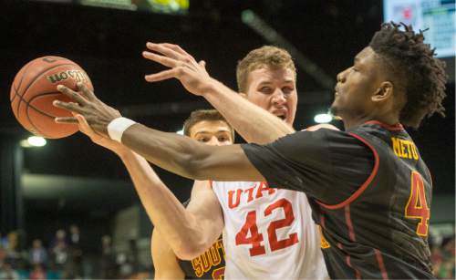 Rick Egan  |  The Salt Lake Tribune

USC Trojans forward Chimezie Metu (4) knocks the ball from out of the hands of Utah Utes forward Jakob Poeltl (42), Metu was a called for a foul on the play, as Utah defeated USC Trojans 80-72, at the MGM Arena, in Las Vegas, Thursday, March 10, 2016.