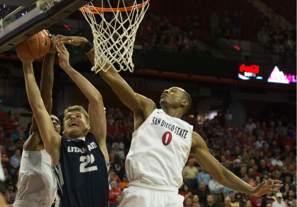 Rick Egan  |  The Salt Lake Tribune

Utah State Aggies forward Quinn Taylor (22) goes up for a shot as San Diego State Aztecs forward Skylar Spencer (0) defends, in Mountain West Tournament action, The Utah State Aggies vs. San Diego State Aztecs, at the Thomas and Mack Center in Las Vegas, Thursday, March 10, 2016.