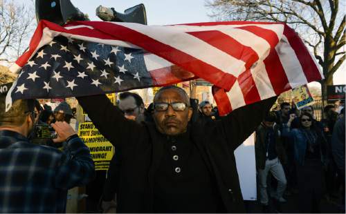 Protestor Sanko Hampton marches in Chicago on Friday, March 11, 2016, before a rally with Republican presidential candidate Donald Trump at the University of Illinois-Chicago. (AP Photo/Matt Marton)