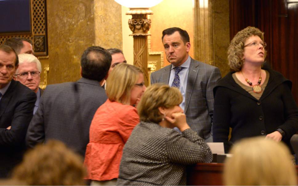 Leah Hogsten  |  The Salt Lake Tribune
House members, including House Speaker Greg Hughes, were shaken by the disruption of Randy Gardner protesting the death penalty about 8:45 p.m. Gardner was removed from the House gallery by Utah Highway Patrol Trooper Aaron Colvin on Thursday, March 10, 2016 ó the last evening of the 2016 legislative session. Gardner showed a banner that contained gory photographs of his brother Ronnie Lee Gardner, who was executed by firing squad in 2010.