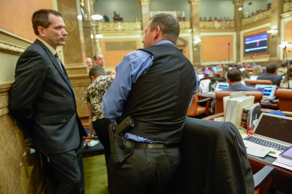 Francisco Kjolseth | The Salt Lake Tribune
Like many legislators up at the Capitol Paul Ray, R-Clearfield, pack a gun as he speaks with Raymond Ward, R-Bountiful, as they talk during the last night of the Legislature on Thursday, March 10, 2016.