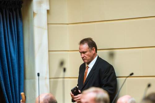 Chris Detrick  |  The Salt Lake Tribune
Sen. Mark Madsen stands in the back of the Senate chambers during Senate Floor Time at the Utah State Capitol on Thursday.