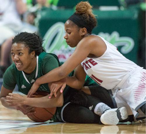 Rick Egan  |  The Salt Lake Tribune

Utah Valley University guard Patrice Toston (20) steals the ball from New Mexico State Aggies guard Shanice Davis (11),  in Western Athletic Conference playoff action, at the Orleans Arena, in Las Vegas, Saturday, March 11, 2016.