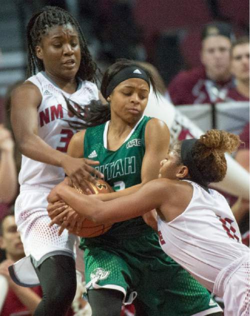 Rick Egan  |  The Salt Lake Tribune


New Mexico State Aggies forward Jeneva Toilolo (33) and New Mexico State Aggies guard Shanice Davis (11) try to get the ball from Utah Valley University Wolverines guard Mariah Seals (3), in Western Athletic Conference playoff action, at the Orleans Arena, in Las Vegas, Saturday, March 11, 2016.