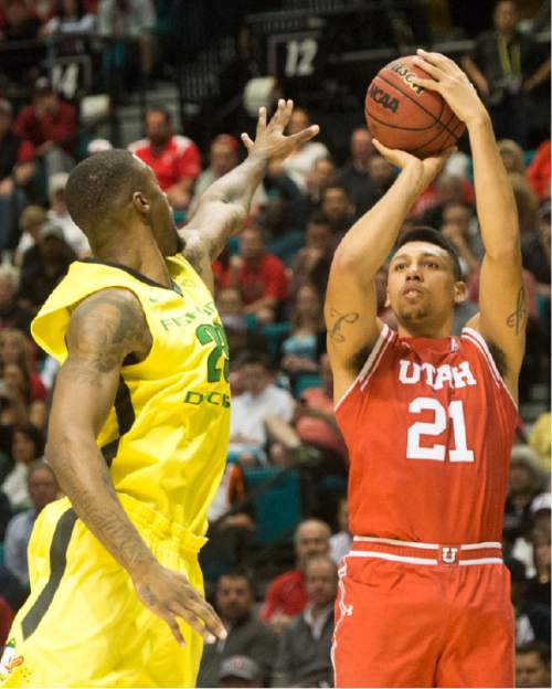 Rick Egan  |  The Salt Lake Tribune

Utah Utes forward Jordan Loveridge (21) shoots as Oregon Ducks forward Elgin Cook (23) defends, in the PAC-12 Basketball Championship game, The Utah Utes vs.The Oregon Ducks, at the MGM Arena, in Las Vegas, Friday, March 12, 2016.