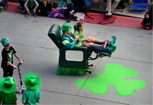 Scott Sommerdorf   |  The Salt Lake Tribune  
A motorized easy-chair zips down Rio Grande Street as they march in the 40th annual St. Patrick's Day parade organized by the Hibernian Society of Utah, Saturday, March 12, 2016.