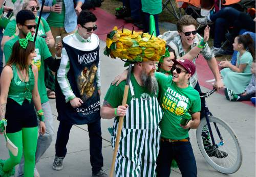 Scott Sommerdorf   |  The Salt Lake Tribune  
The Squatters brewery contingent marches in the 40th annual St. Patrick's Day parade organized by the Hibernian Society of Utah, Saturday, March 12, 2016.