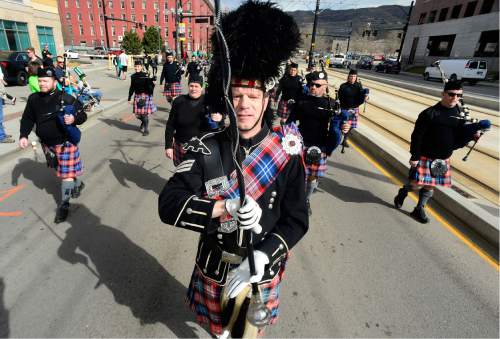 Scott Sommerdorf   |  The Salt Lake Tribune  
Drum Major Ben Tyler leads the White Peaks Centennial Pipe Band from Payson, Utah, in the 40th annual St. Patrick's Day parade organized by the Hibernian Society of Utah, Saturday, March 12, 2016.