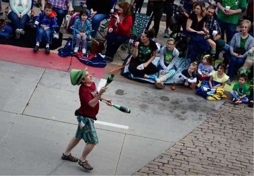Scott Sommerdorf   |  The Salt Lake Tribune  
A juggler entertained as he marched in the 40th annual St. Patrick's Day parade organized by the Hibernian Society of Utah, Saturday, March 12, 2016.
