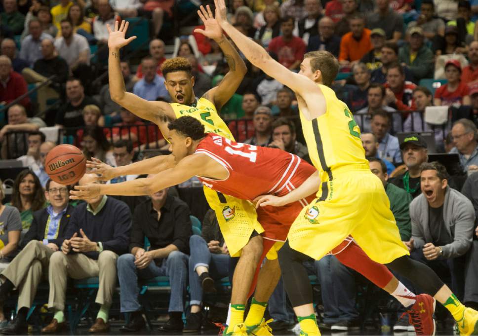 Rick Egan  |  The Salt Lake Tribune

Utah Utes guard Lorenzo Bonam (15) tries to get a pass,as he is guarded by Oregon Ducks guard Tyler Dorsey (5) and Oregon Ducks guard Casey Benson (2), in the PAC-12 Basketball Championship game, The Utah Utes vs.The Oregon Ducks, at the MGM Arena, in Las Vegas, Friday, March 12, 2016.