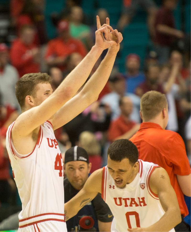 Rick Egan  |  The Salt Lake Tribune

Utah forward Jakob Poeltl (42) and Brekkott Chapman (0) celebrate the Utes 82-78 overtime win over the California Golden Bears, in PAC-12 Basketball Championship semi-finals, Utah Utes vs.The California Golden Bears, at the MGM Arena, in Las Vegas, Friday, March 11, 2016.