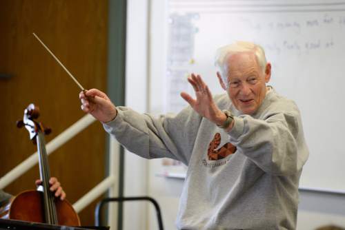 Francisco Kjolseth | The Salt Lake Tribune
Jack Ashton, former longtime Utah Symphony violinist, for more than 30 years, works with the Young Artist Chamber Players at Highland High recently. The youth orchestra is getting ready for a concert tour to Europe.