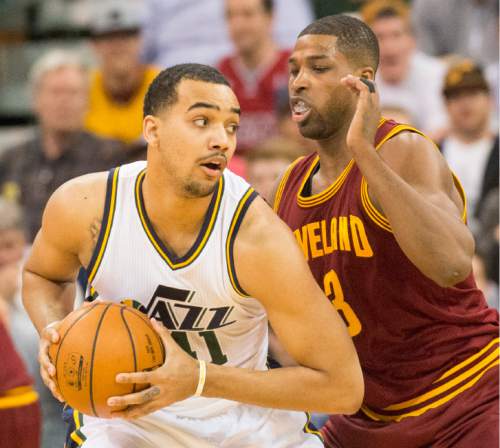 Rick Egan  |  The Salt Lake Tribune

Utah Jazz forward Trey Lyles (41) is guarded by Cleveland Cavaliers center Tristan Thompson (13), in NBA action, in Salt Lake City, Monday March 14, 2016.