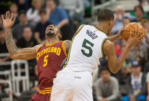 Rick Egan  |  The Salt Lake Tribune

Utah Jazz guard Rodney Hood (5) collides with Cleveland Cavaliers guard J.R. Smith (5), in NBA action, in Salt Lake City, Monday March 14, 2016.