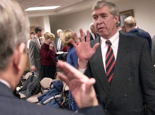 Francisco Kjolseth  |  The Salt Lake Tribune

Former South Salt Lake Mayor Randy Fitts, right, speaks with  newly sworn mayor of Holladay Dennis Webb on Monday January 5, 2004, as Fitts gets ready to become interim city manager for the city of Holladay.