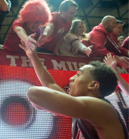 Rick Egan  |  The Salt Lake Tribune

Guard Brandon Taylor (11) shakes hands with fans after the Utes 57-55 win over Colorado, in Pac-12 basketball action at the Huntsman Center Saturday, March 5, 2016.