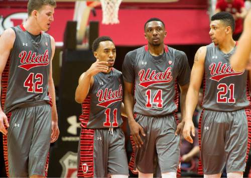 Rick Egan  |  The Salt Lake Tribune

Utah Utes forward Jakob Poeltl (42), Brandon Taylor (11), Dakarai Tucker (14) and Jordan Loveridge (21) gather together during a break in the action as the Utes lead Colorado, in the final minutes o the game, in Pac-12 basketball action at the Huntsman Center Saturday, March 5, 2016.