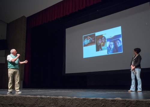 Rick Egan  |  The Salt Lake Tribune

Clark and Debbie Hill, tell the story of their daughter Chelsie, during an assembly with the seniors at Herriman High about the dangers of distracted driving, Thursday, March 17, 2016.