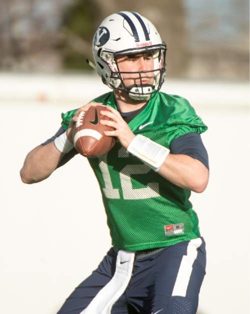 Rick Egan  |  The Salt Lake Tribune

BYU quarterback Tanner Mangum (12) throws the ball during passing drills, on the second day of spring practice, in Provo, Thursday, March 3, 2016.