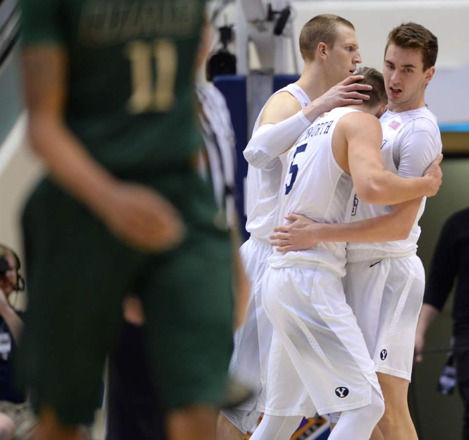 Steve Griffin  |  The Salt Lake Tribune


Brigham Young Cougars guard Kyle Collinsworth (5) is hugged by his teammates after throwing down two huge dunks forcing UAB to call a timeout during the first round of the NIT between BYU and UAB at the Marriott Center in Provo, Wednesday, March 16, 2016.