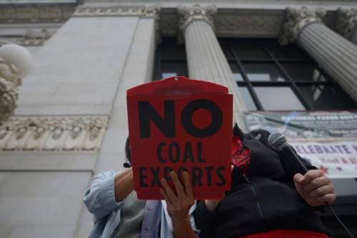 Lora Foo stands in front of Oakland City Hall on July 21, 2015, speaking out against the plan to build a coal-export facility at the former Oakland Army Base. California's opposition to coal transport is just one hurdle to four Utah counties' dreams of shipping their coal overseas through Oakland.