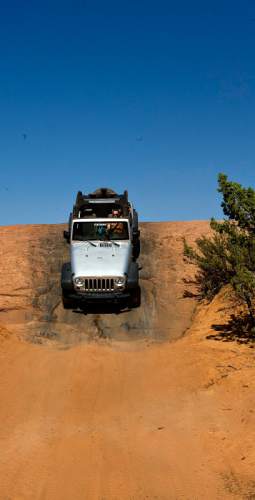 Djamila Grossman  |  The Salt Lake Tribune
Rob Covert drives a jeep on the Fins & Things 4x4 trail near Moab, Utah, on Saturday, Oct. 2, 2010.