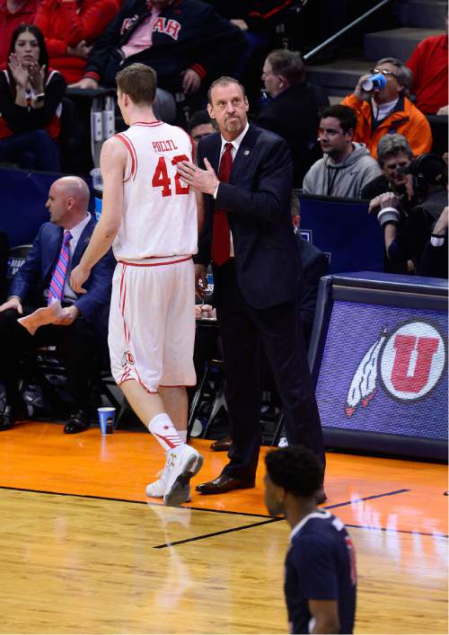 Scott Sommerdorf   |  The Salt Lake Tribune  
Utah Utes head coach Larry Krystkowiak welcomed Utah Utes forward Jakob Poeltl (42) to the bench after he took him out for a rest during first half play. Utah beat Fresno State 80-69 in Denver, Thursday, March 17, 2016.