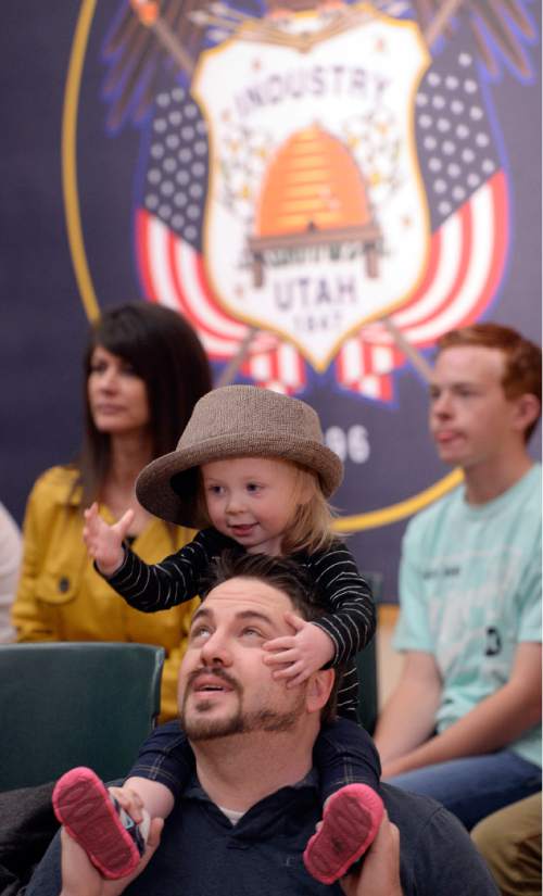 Al Hartmann  |  The Salt Lake Tribune
Matty White and daughter Reagan, 2, or Orem play as they wait for Republican candidate for President, Ohio Governor John Kasich to hold a town hall meeting at Utah Valley University in Orem, Friday March 18.