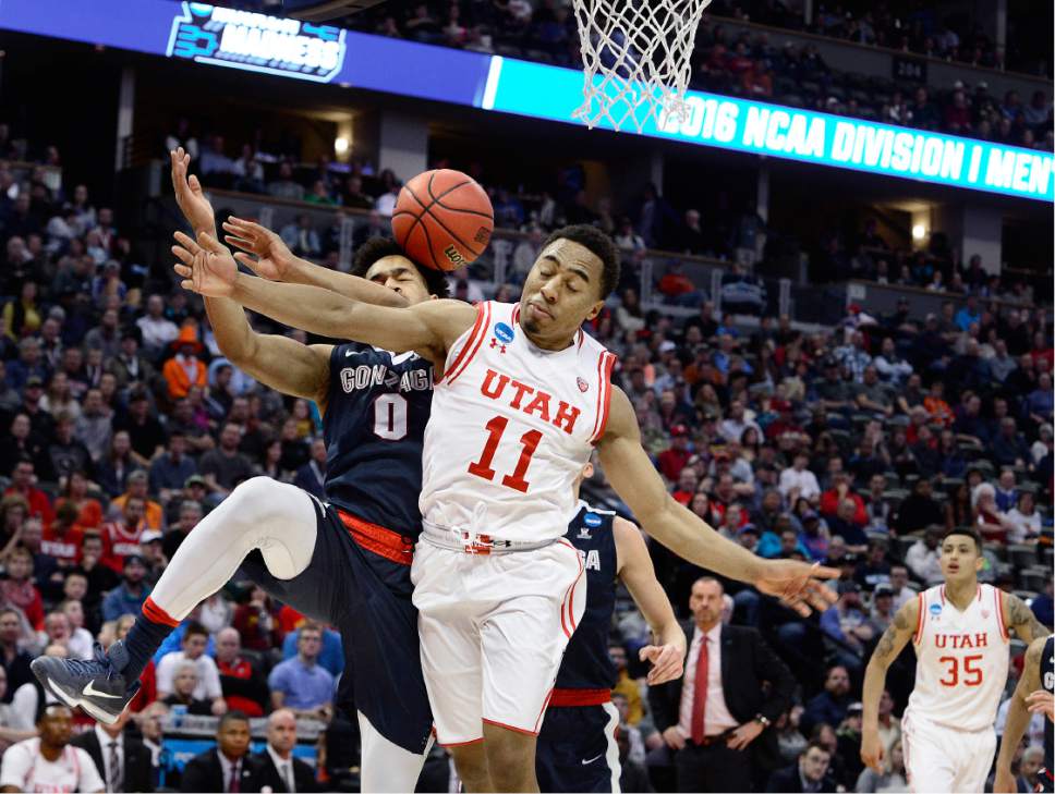 Scott Sommerdorf   |  The Salt Lake Tribune  
Utah G Brandon Taylor's drive to the hoop is broken up by Gonzaga G Silas Melson (0) during second half play. Gonzaga beat Utah 82-59 in Denver, Saturday, March 19, 2016.