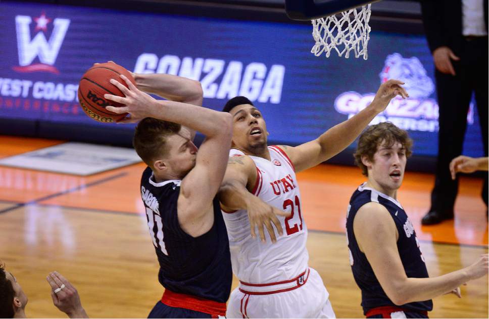 Scott Sommerdorf   |  The Salt Lake Tribune  
Utah F Jordan Loveridge (21) tries to defend Gonzaga F Domantas Sabonis (11)  during first half play. Gonzaga held a 44-29 lead over Utah at the half, Saturday, March 19, 2016.