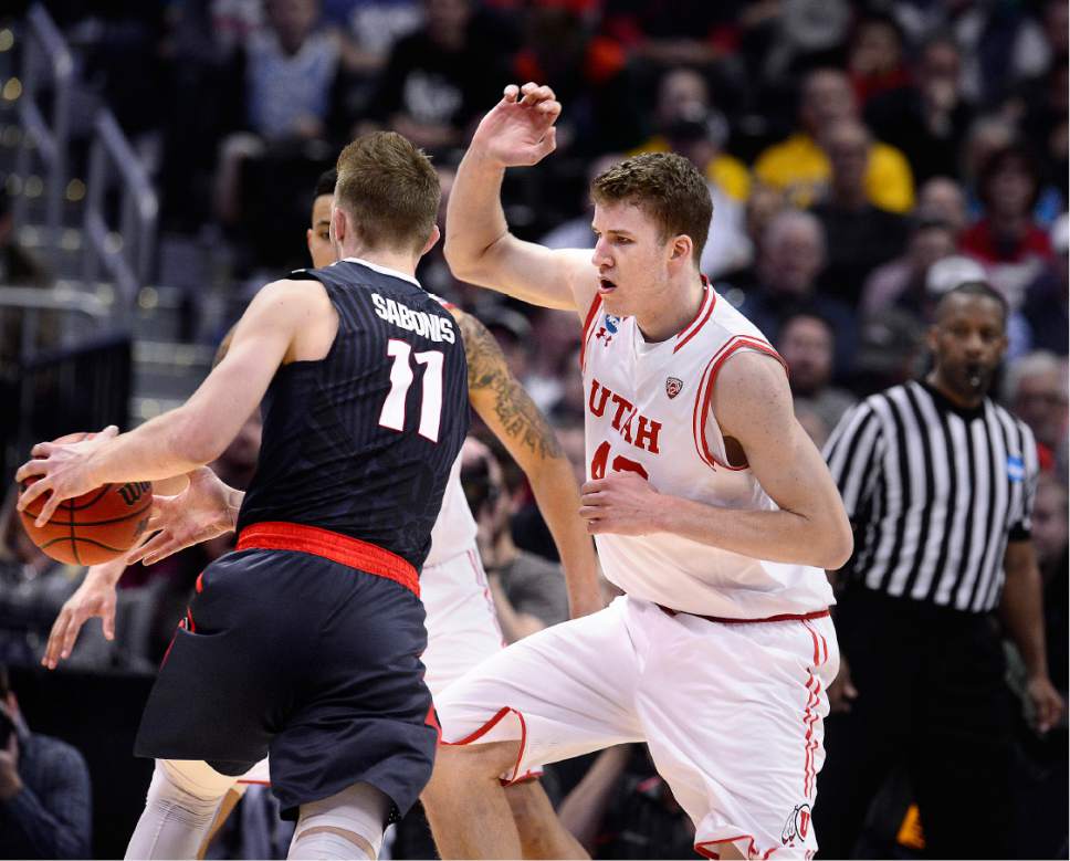 Scott Sommerdorf   |  The Salt Lake Tribune  
Utah F Jakob Poeltl (42) tries to defend against Gonzaga F Domantas Sabonis (11) during second half play. Gonzaga beat Utah 82-59 in Denver, Saturday, March 19, 2016.