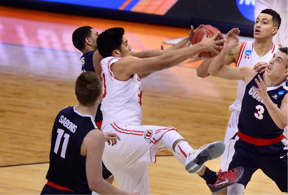 Scott Sommerdorf   |  The Salt Lake Tribune  
Utah F Chris Reyes (20) battles under the hoop during first half play. Gonzaga beat Utah 82-59 in Denver, Saturday, March 19, 2016.