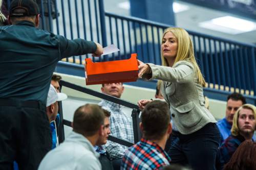 Chris Detrick  |  The Salt Lake Tribune
Carolyn Phippen collects Presidential ballets from voters in precinct 13 during the Republican caucus at Corner Canyon High School Tuesday March 22, 2016.