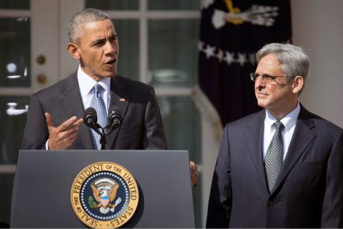 Federal appeals court judge Merrick Garland, right, stands with President Barack Obama as he is introduced as Obama's nominee for the Supreme Court during an announcement in the Rose Garden of the White House, in Washington, Wednesday, March 16, 2016. Garland, 63, is the chief judge for the United States Court of Appeals for the District of Columbia Circuit, a court whose influence over federal policy and national security matters has made it a proving ground for potential Supreme Court justices. (AP Photo/Pablo Martinez Monsivais)