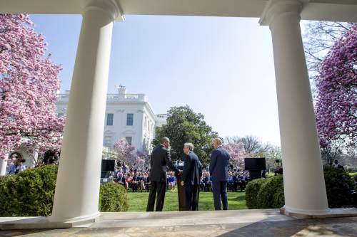 Federal appeals court judge Merrick Garland, center, accompanied by Vice President Joe Biden, right, shakes hands with President Barack Obama as he is introduced as Obama's nominee for the Supreme Court during an announcement in the Rose Garden of the White House, in Washington, Wednesday, March 16, 2016. Garland, 63, is the chief judge for the United States Court of Appeals for the District of Columbia Circuit, a court whose influence over federal policy and national security matters has made it a proving ground for potential Supreme Court justices. (AP Photo/Andrew Harnik)