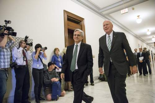 Sen. Patrick Leahy, D-Vt., right, the top Democrat on the Senate Judiciary Committee walks with Judge Merrick Garland, President Barack Obama's choice to replace the late Justice Antonin Scalia on the Supreme Court, on Capitol Hill in Washington, Thursday, March 17, 2016. Senate Majority Leader Mitch McConnell, R-Ky., has been steadfast in his refusal to hold a confirmation hearing for any nominee during the waning months of Obama's presidency.  (AP Photo/J. Scott Applewhite)