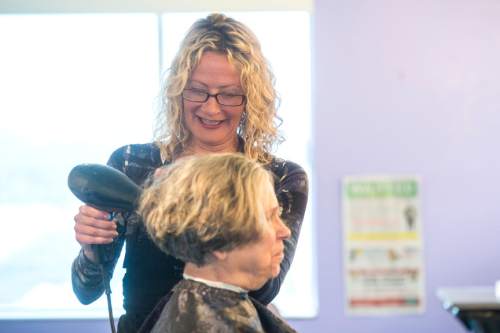 Chris Detrick  |  The Salt Lake Tribune
Brenda Sue Cowley works on Carol Karnes' hair at 9th Avenue Salon Wednesday March 23, 2016.  The 9th Avenue Salon is closing this week after having been open for more than 40 years. Actor Brenda Sue Cowley took over the salon seven years ago after the passing of its well-known owner, Michael Adamson.