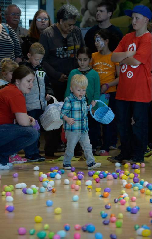 Francisco Kjolseth | The Salt Lake Tribune
Brock Anderson, 2, surveys the landscape as Shriners Hospitals hosts an Easter Egg Hunt adapted for patients with physical challenges. Around 100 patients and their families attended Wednesday's annual Easter Egg Hunt, which gave children with physical challenges who may be in wheelchairs or rely on the assistance of a walker, the space, time and support they needed to enjoy the Spring time tradition.