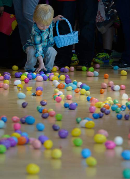 Francisco Kjolseth | The Salt Lake Tribune
Brock Anderson, 2, gets an early feel of the goods as Shriners Hospitals hosts an Easter Egg Hunt adapted for patients with physical challenges. Around 100 patients and their families attended Wednesday's annual Easter Egg Hunt, which gave children with physical challenges who may be in wheelchairs or rely on the assistance of a walker, the space, time and support they needed to enjoy the Spring time tradition.