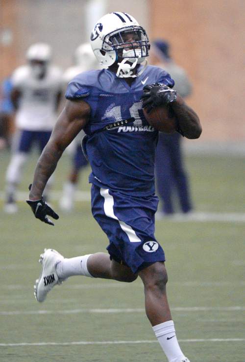 Al Hartmann  |  The Salt Lake Tribune
Running back Squally Canada, a transfer from Washington State who will be eligible this season works out with BYU running backs Tuesday March 22.
