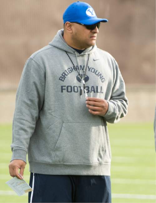 Rick Egan  |  The Salt Lake Tribune

BYU head coach Kalani Sitake watches the Cougars work out on the second day of spring practice, in Provo, Thursday, March 3, 2016.