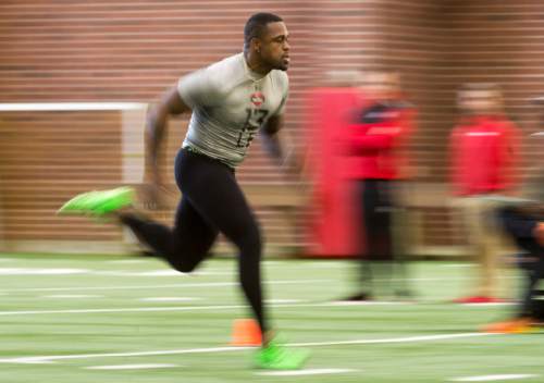 Rick Egan  |  The Salt Lake Tribune

Gionni Paul (13), runs drills for the NFL scouts during the Uof U's annual Pro Day, at the University of Utah, Thursday, March 24, 2016.
