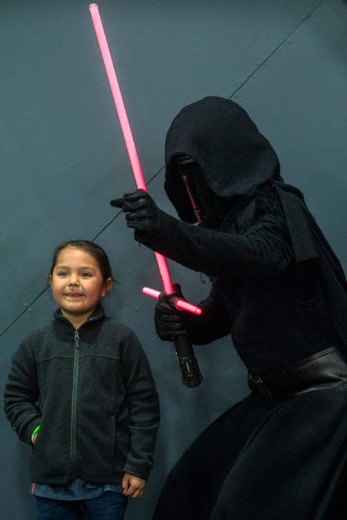 Chris Detrick  |  The Salt Lake Tribune
Jaiden Taylor, 5, poses for a picture with Kylo Ren during Salt Lake Comic Con's FanXperience at the Salt Palace Convention Center Saturday March 26, 2016.